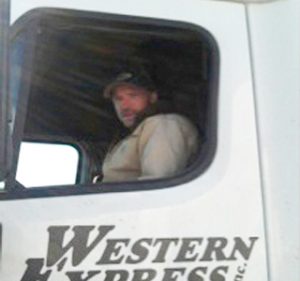 Man driving a semi truck